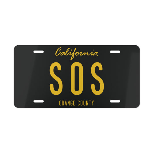 Sitting On Saturn Black Vanity License Plate